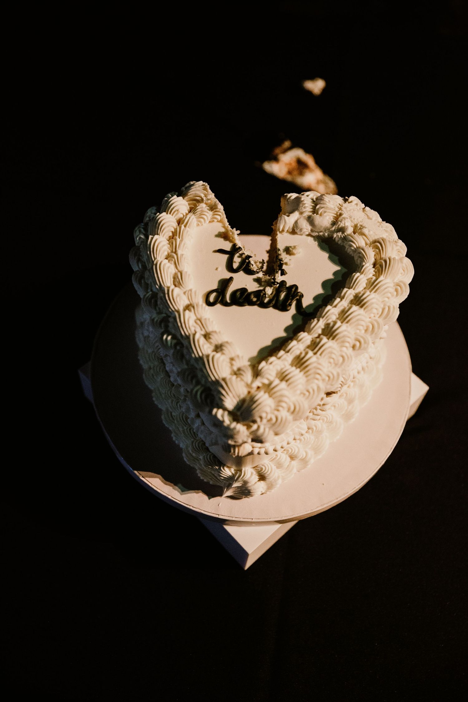 A time-lapse sequence showing a white frosted cake being eaten slice by slice until only crumbs remain on the plate.