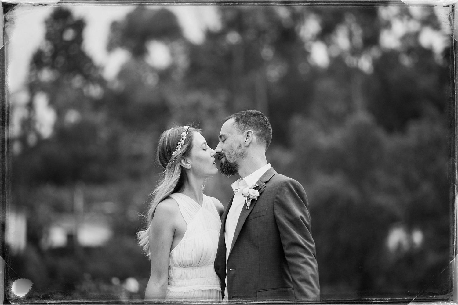 Black and white wedding photo collage showing romantic moments between a couple during their special day.