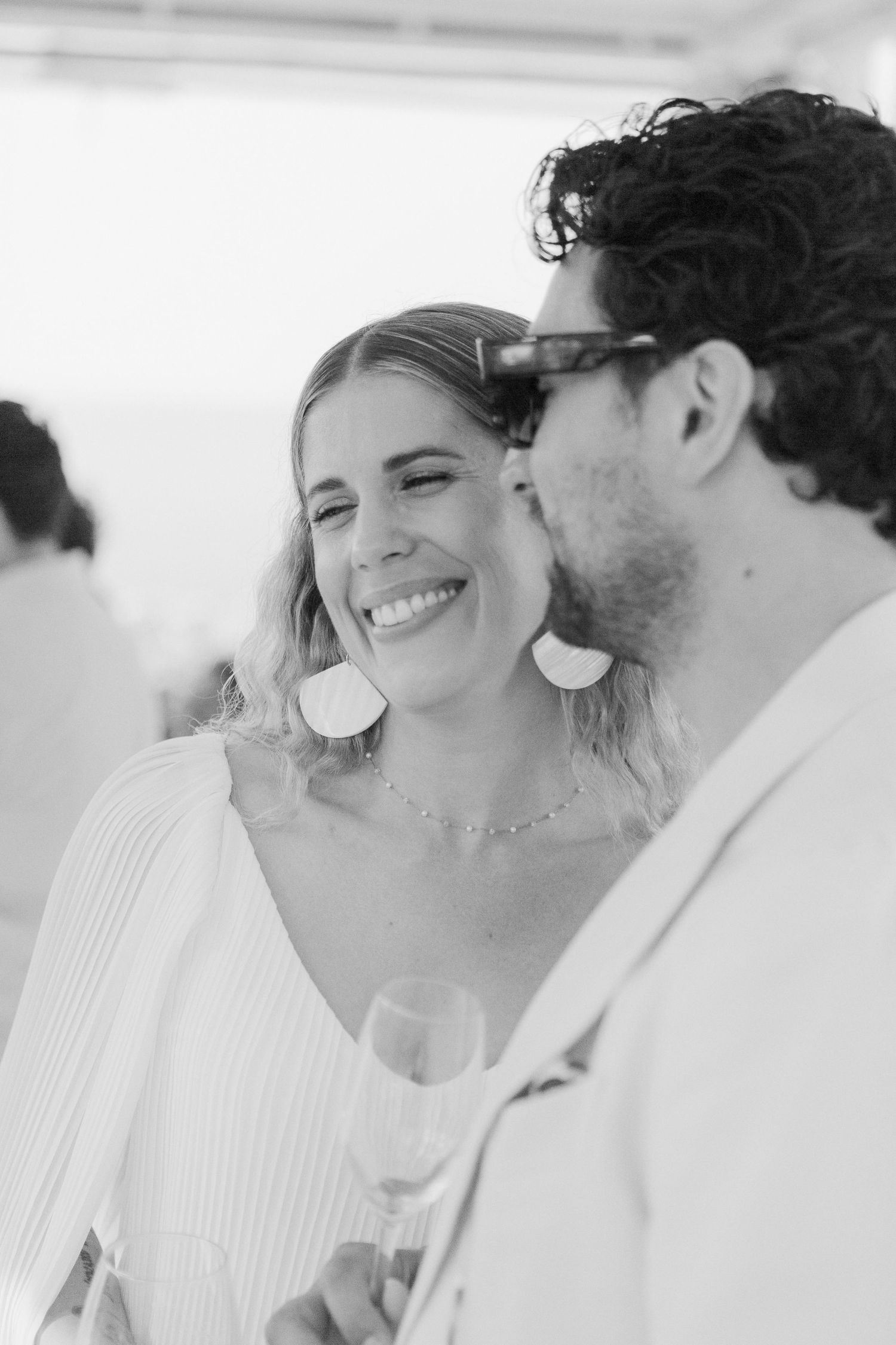 A romantic black and white photo sequence showing a couple sharing intimate moments and laughter together.