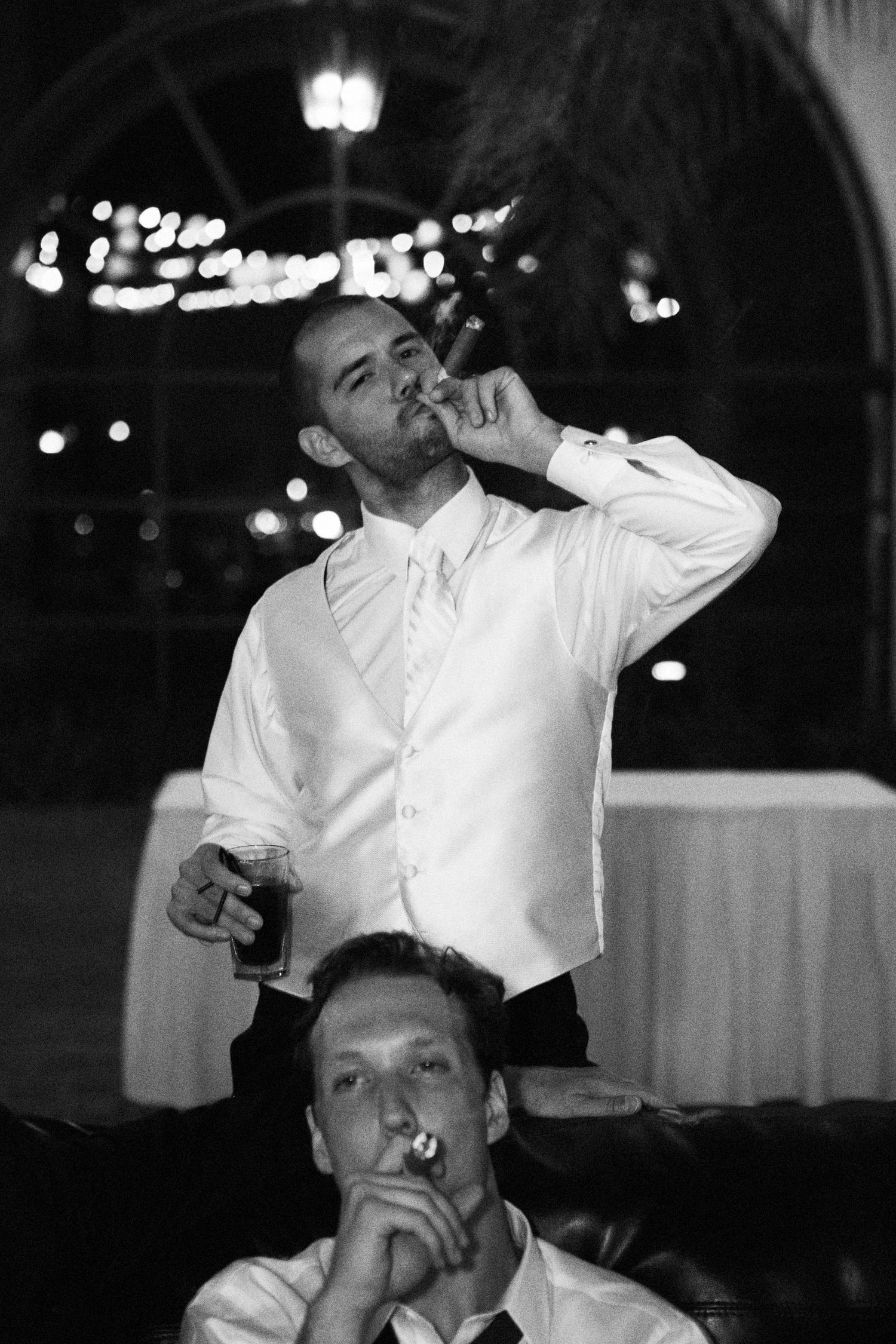 A series of black and white photos showing two people dancing together at a formal event.