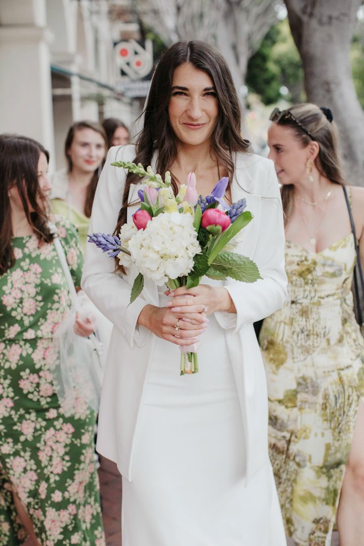 A series of wedding photos showing a person in a white dress holding a colorful bouquet of flowers in an outdoor setting.