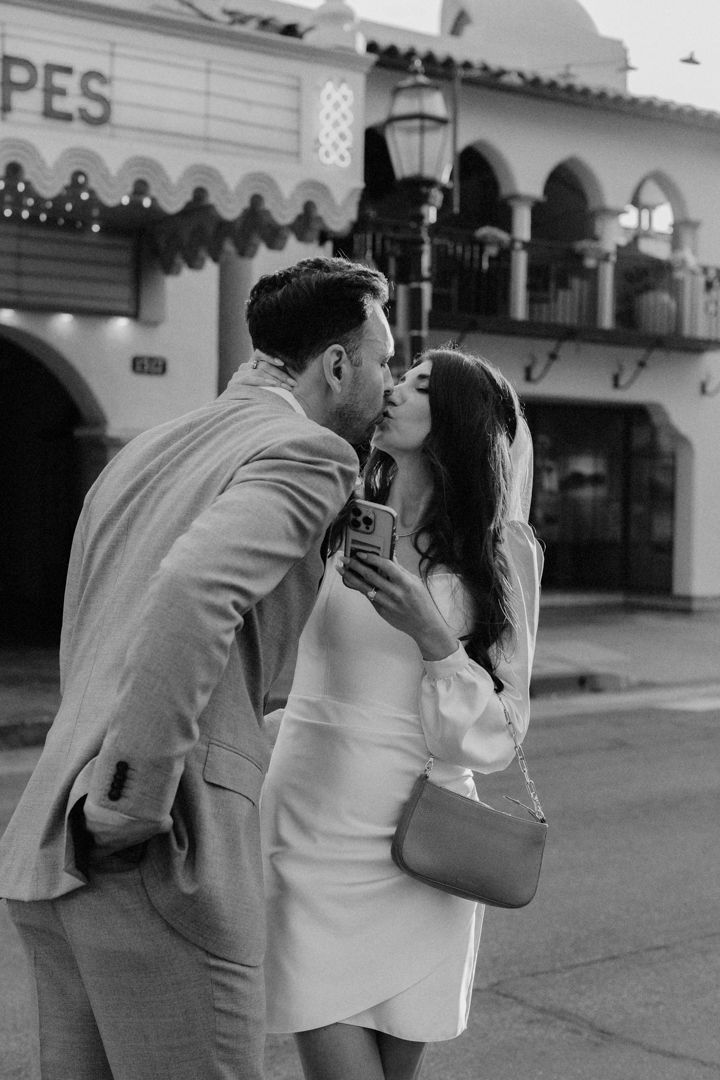 A black and white photo sequence showing a romantic couple sharing intimate moments outside a building.