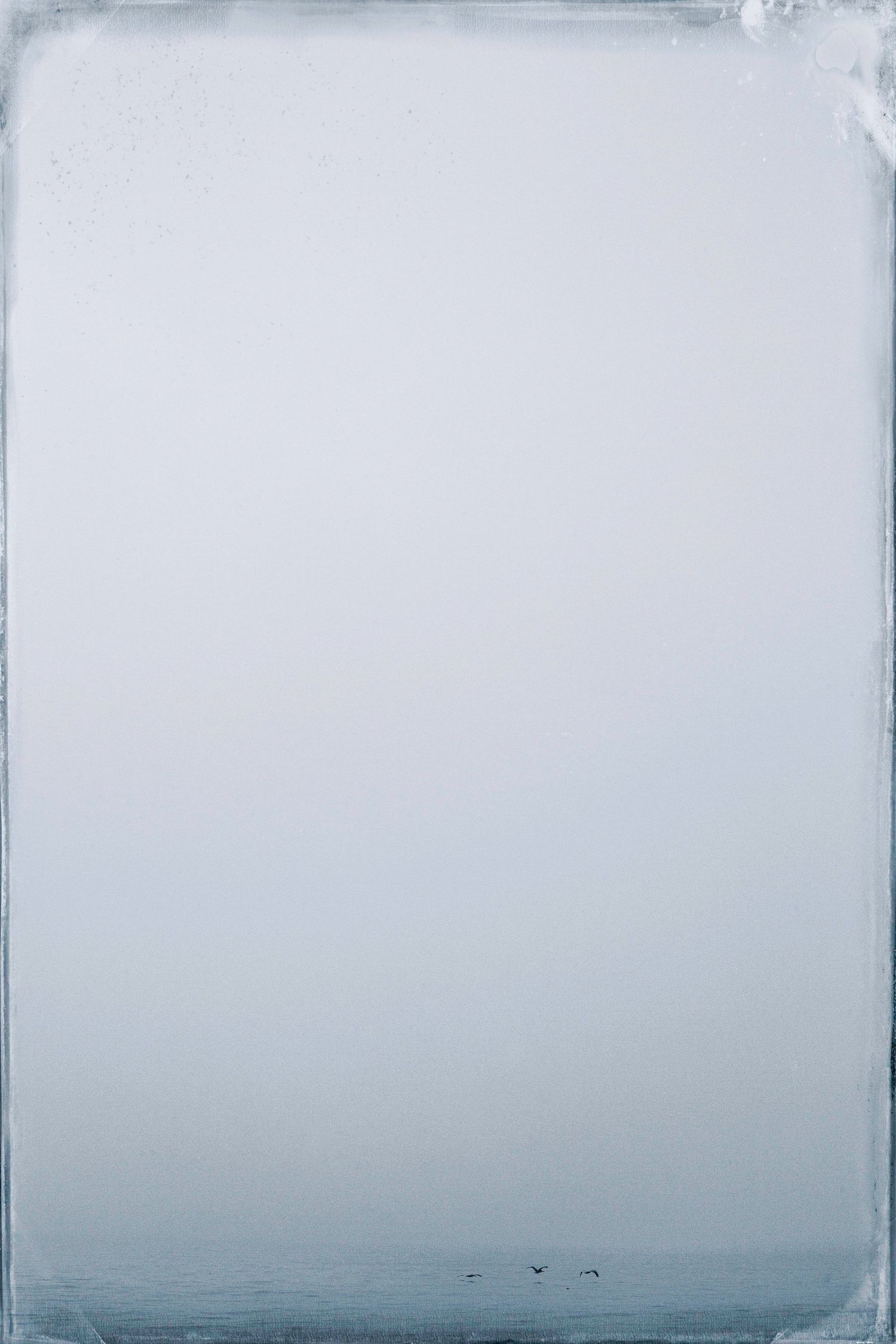 A minimalist composition showing three connected white panels with subtle gray gradient backgrounds.