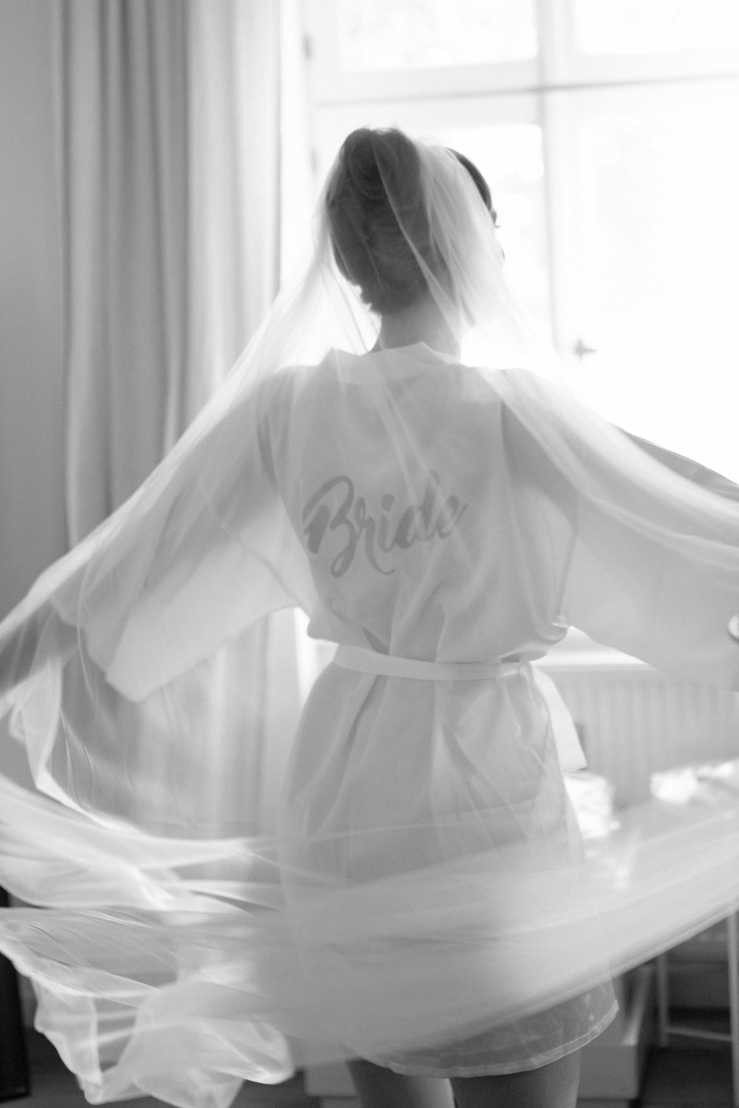 A series of black and white photos showing flowing bridal robes with the word 'Bride' embroidered on them.