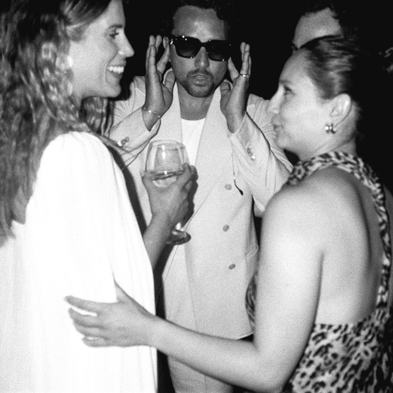 Black and white photo series showing people dancing and socializing at what appears to be a party or club setting.