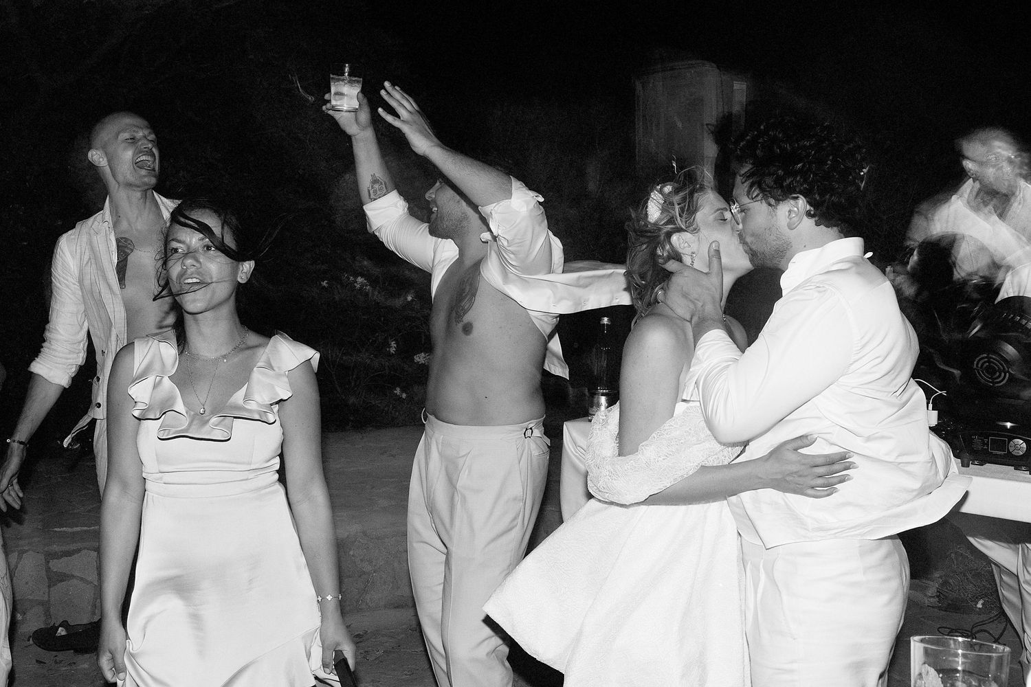 A sequence of black and white dance photos showing people in motion at what appears to be a party or celebration.
