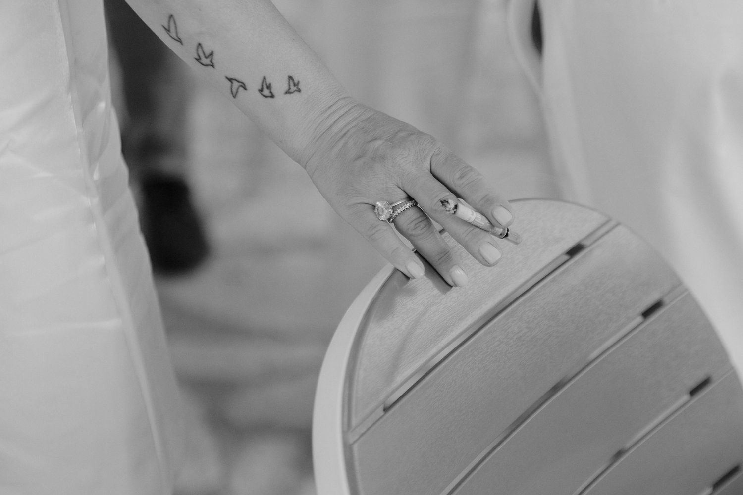 A black and white photo sequence shows a hand writing with a fountain pen on paper.