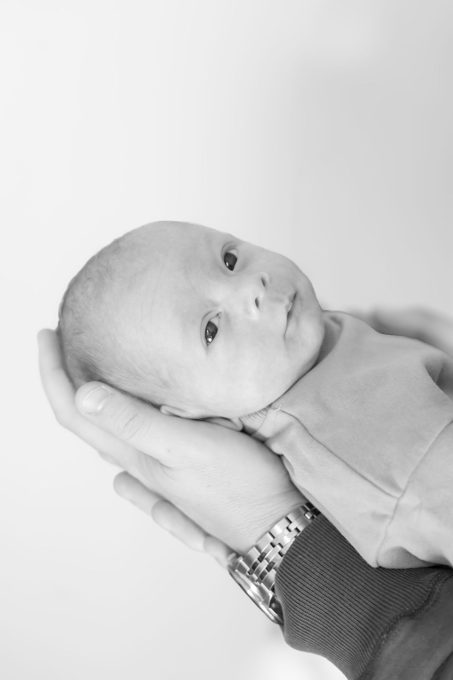 Black and white series showing newborn baby resting peacefully.