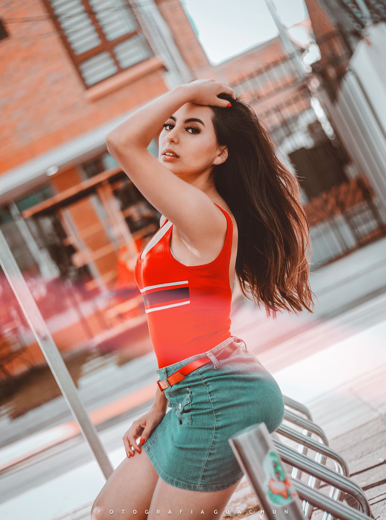 Urban fashion photography in bright orange tones featuring street style poses.