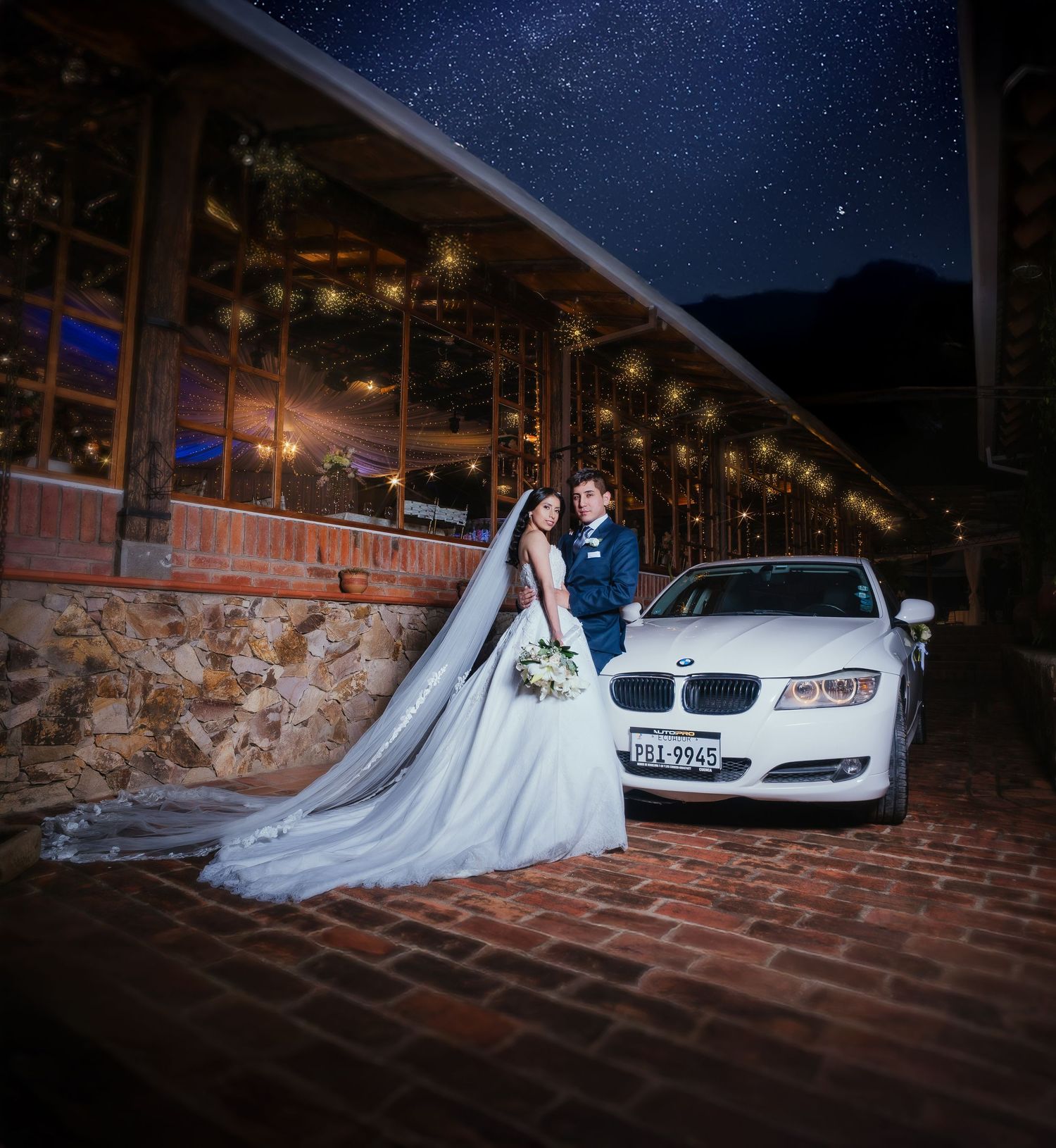 Romantic evening wedding photos with a white luxury car and brick steps under starry skies.