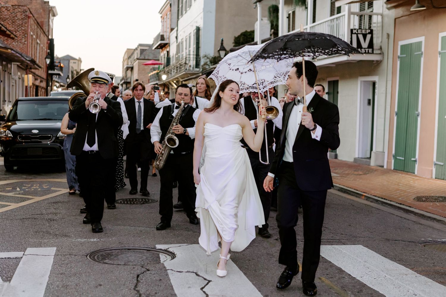 Wedding party doing the second line in New Orleans on the French. Louisiana