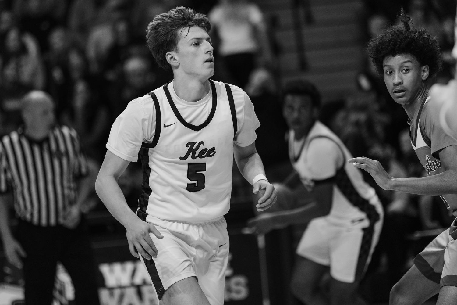 Athletes compete in a high school sports event in Waukee, Iowa, showcasing talent and teamwork