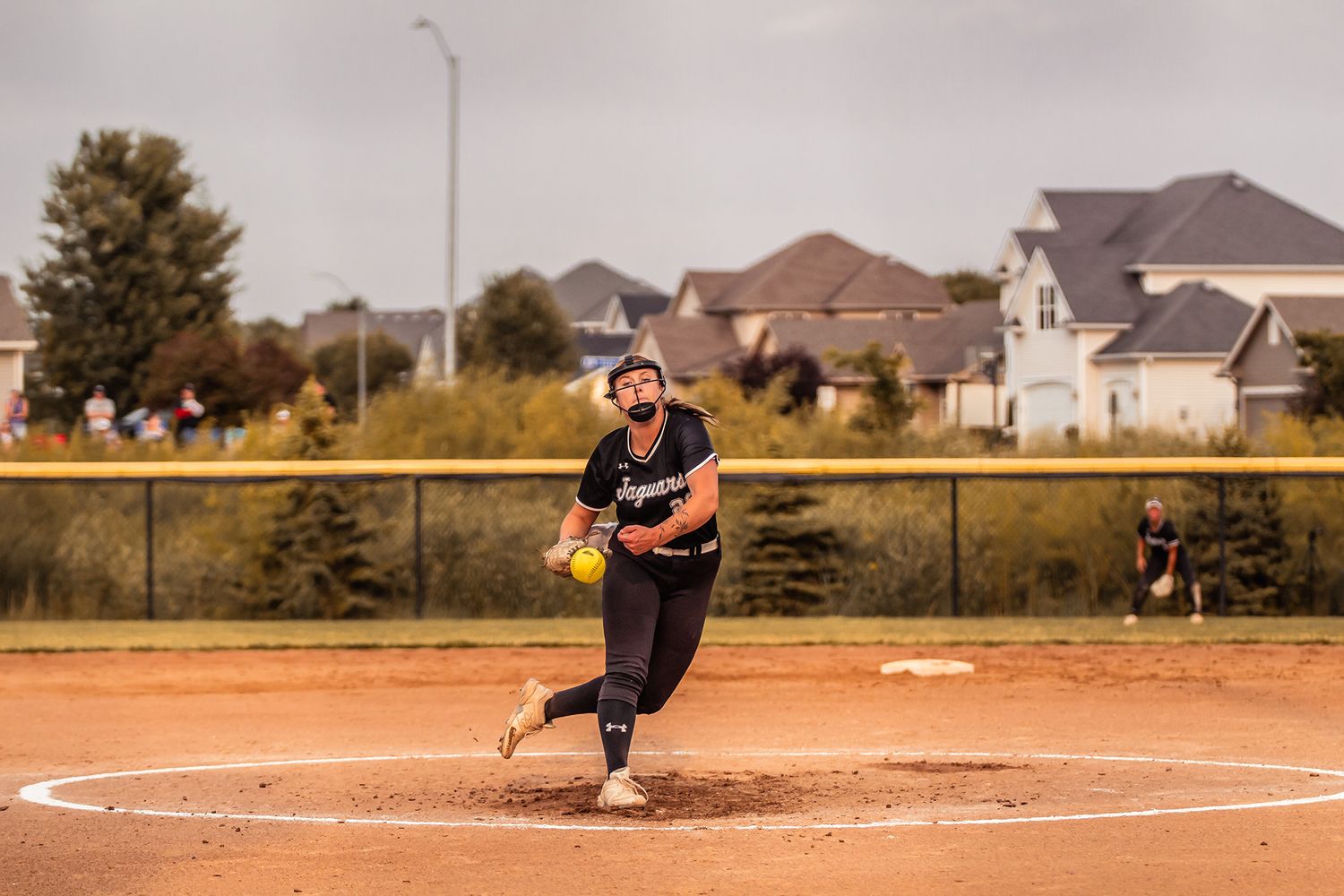 Ankeny Centennial softball player at pitching during an Iowa high school game