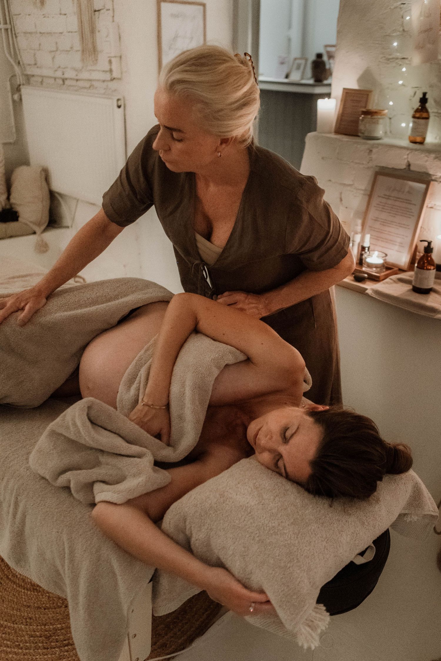 Professional massage therapy session showing therapeutic techniques in a serene spa setting.