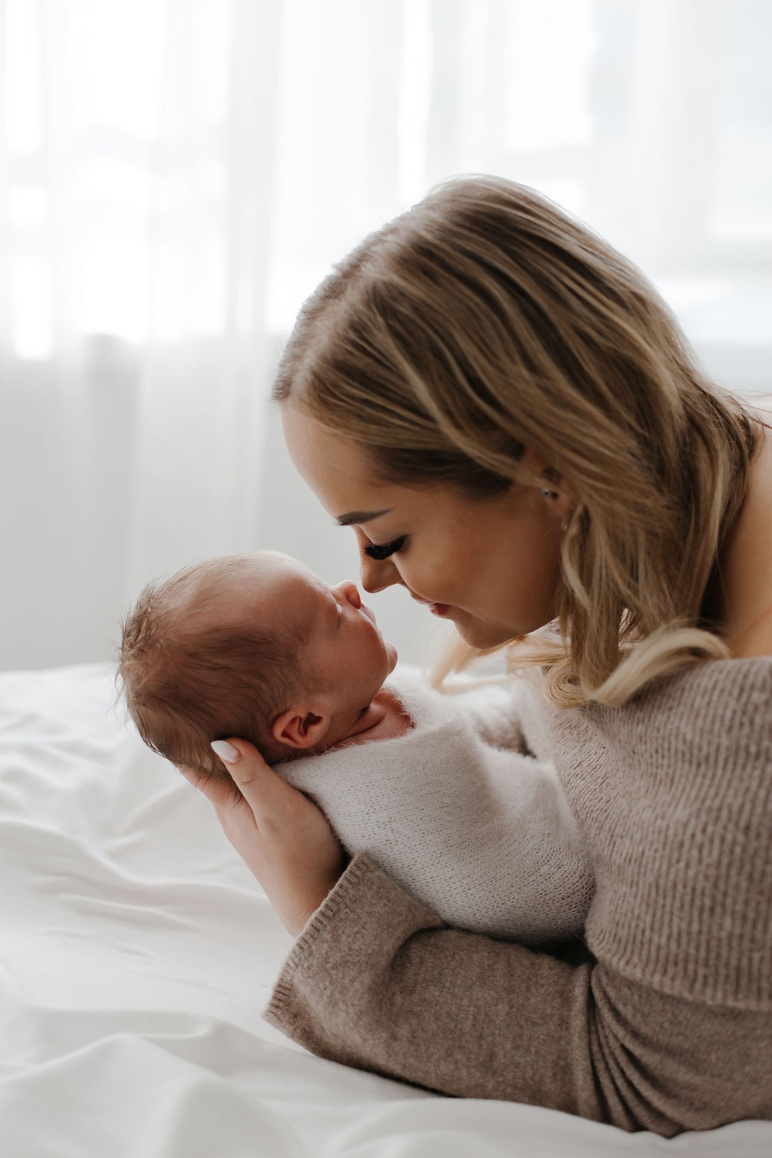 Intimate family portraits showing gentle moments in soft, natural lighting.