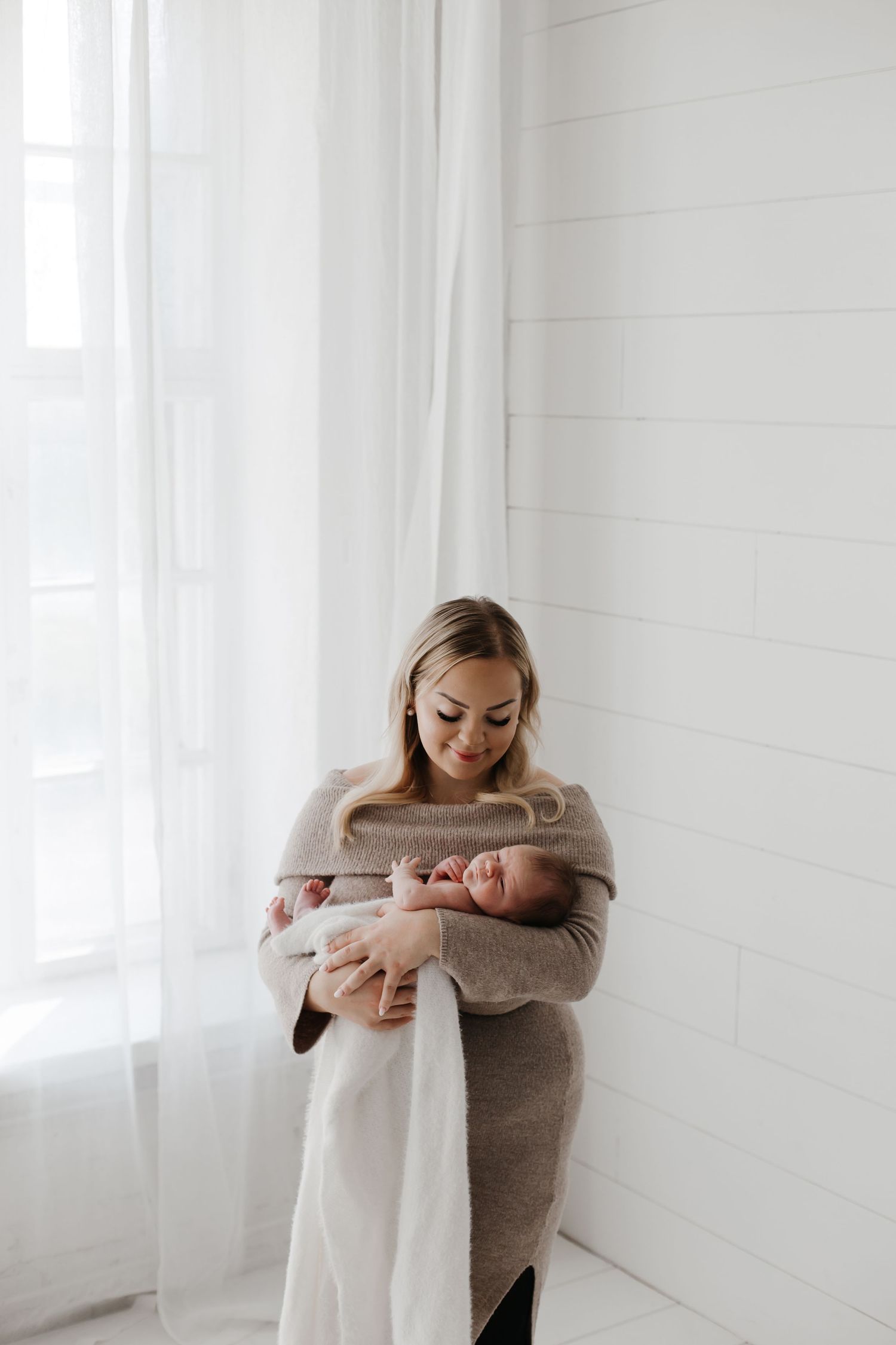 Series showing tender family moments against a white minimalist background.