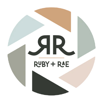 Ruby + Rae photography logo featuring a camera aperture design with muted pastel tones and elegant RR monogram.