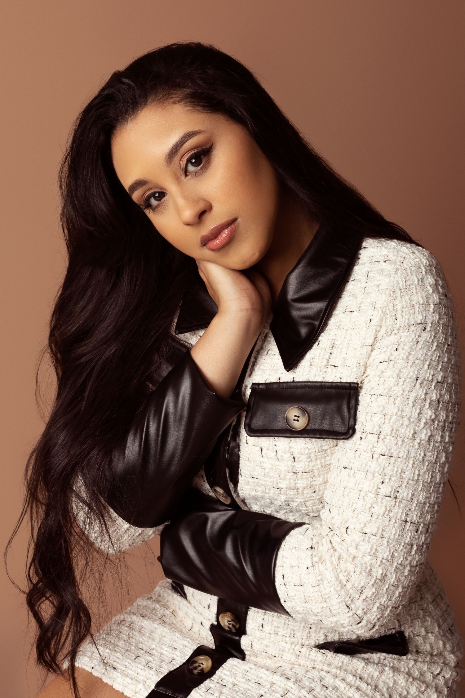 Fashion portrait series showcasing white tweed jacket with black leather collar details.