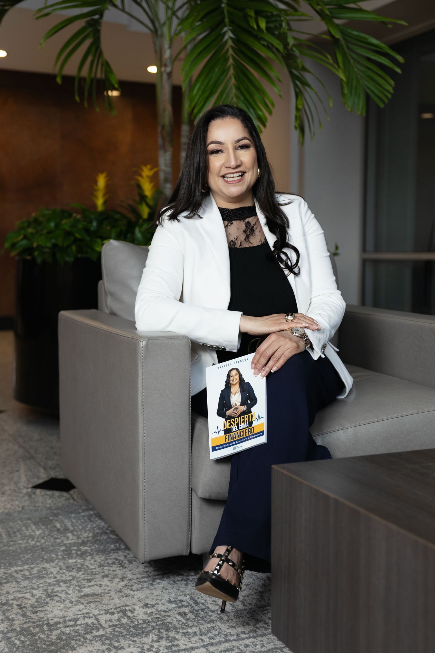 Professional portrait series showing polished business attire with white blazer and black top in modern office setting.
