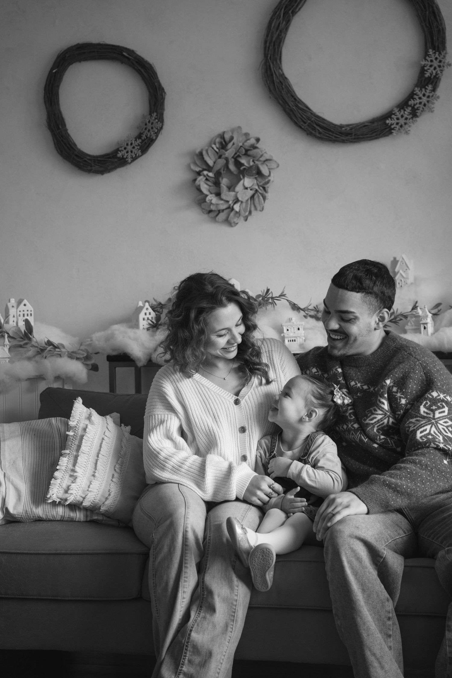 Black and white photo of intimate family moment in studio.