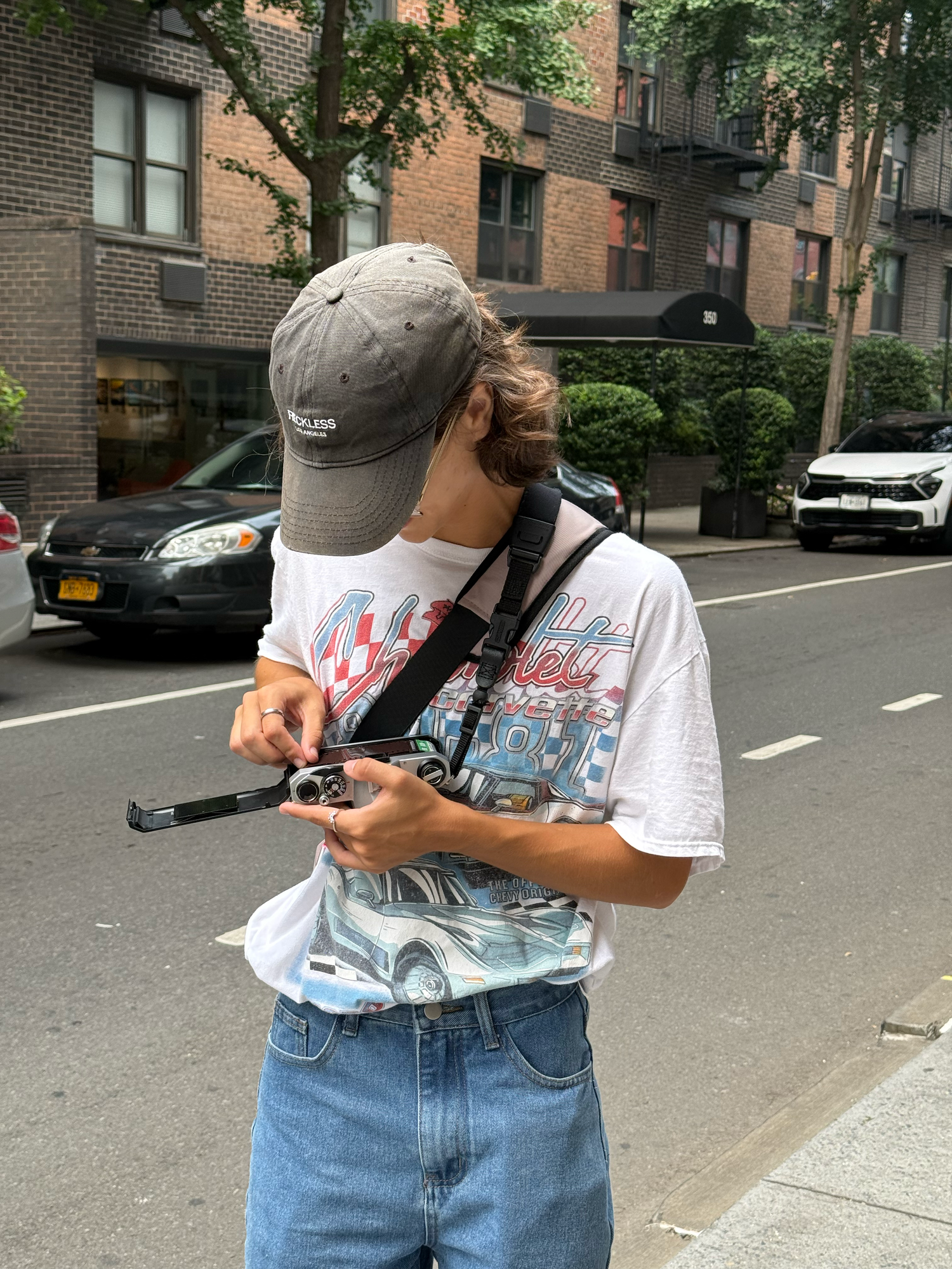 Alexa P. Artistry loading 35mm film on the streets of New York City.