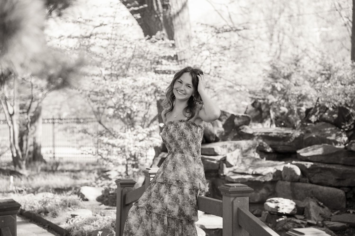 Dreamy black and white outdoor senior session with natural scenery.