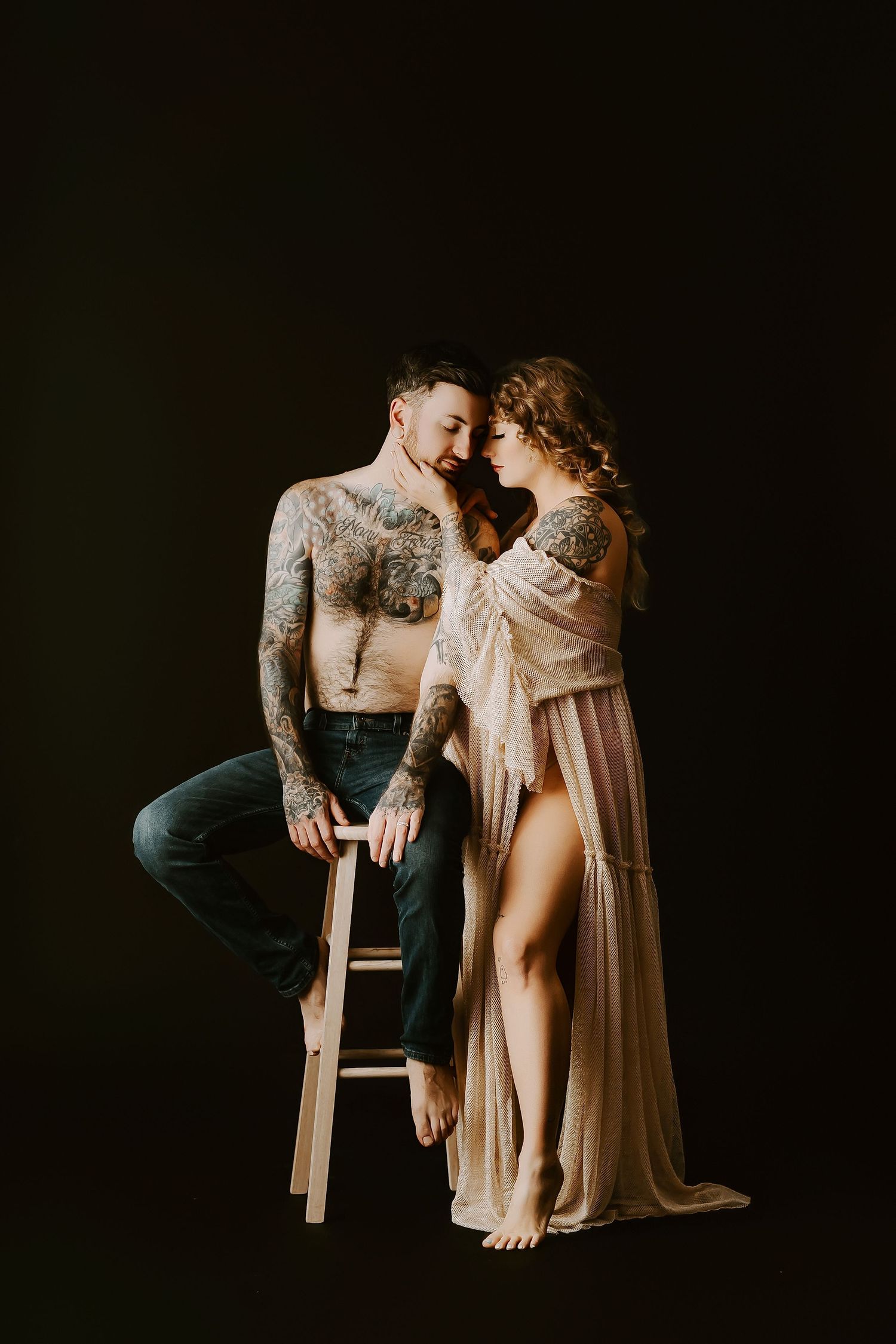 Artistic black and white photo series showing intimate poses between two people in formal attire against dark backdrop.