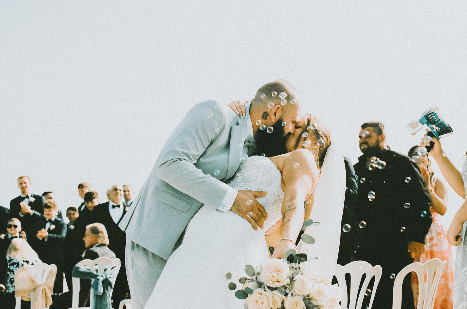 A series of candid wedding reception photos showing guests dancing and celebrating together on the dance floor.