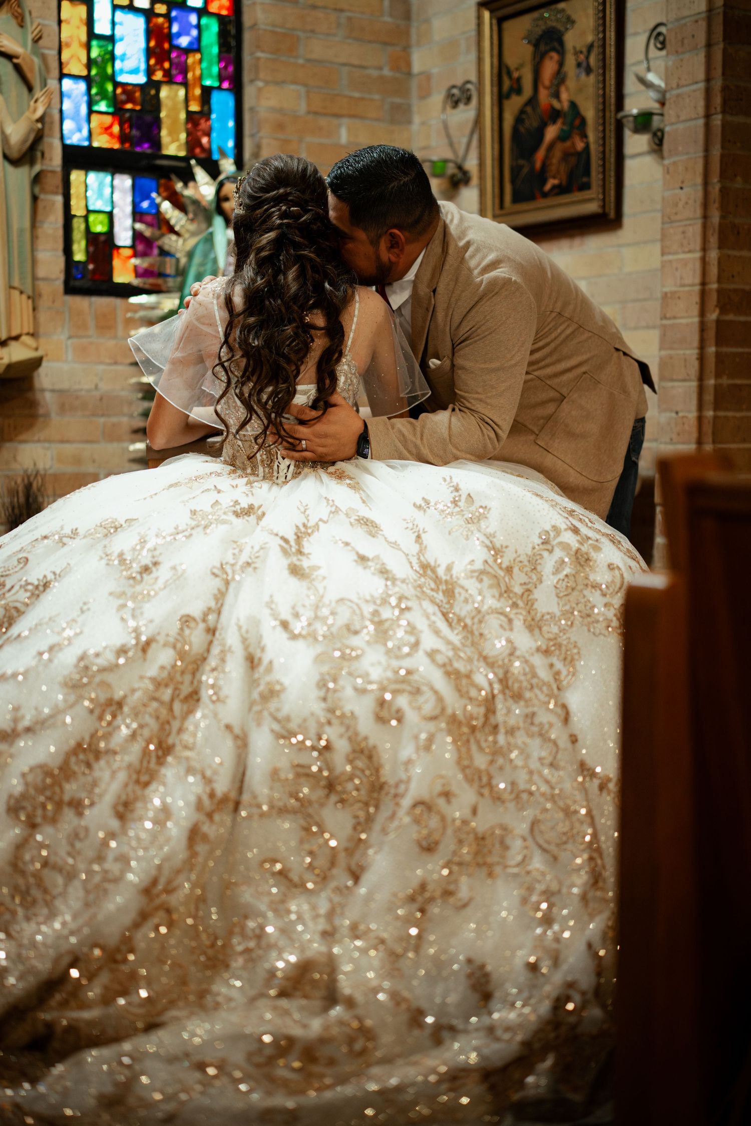Detailed view of an embellished white ball gown with sparkly details.