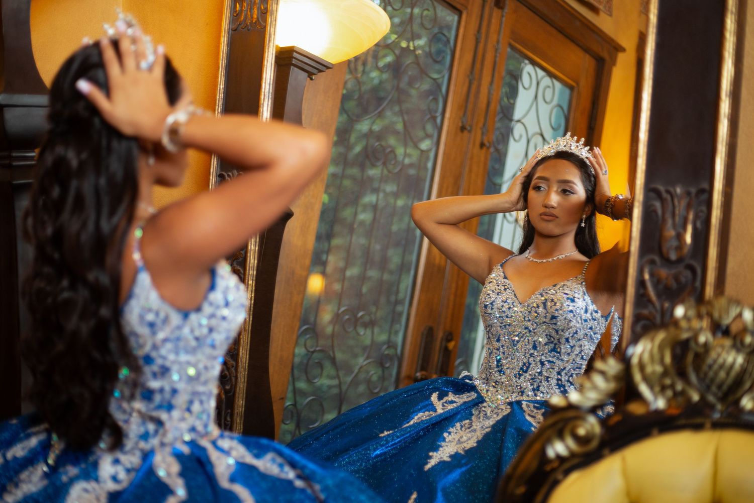 Quinceañera photoshoot showing elegant blue and silver dress details.