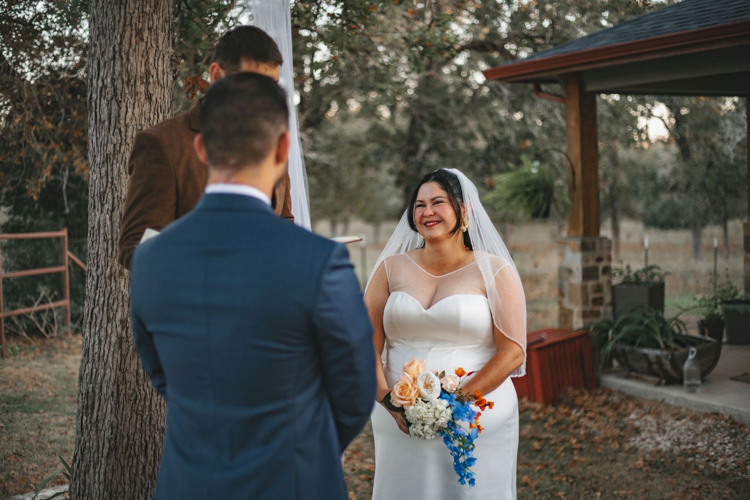 Candid wedding photography showing joyful moments between couple outdoors.