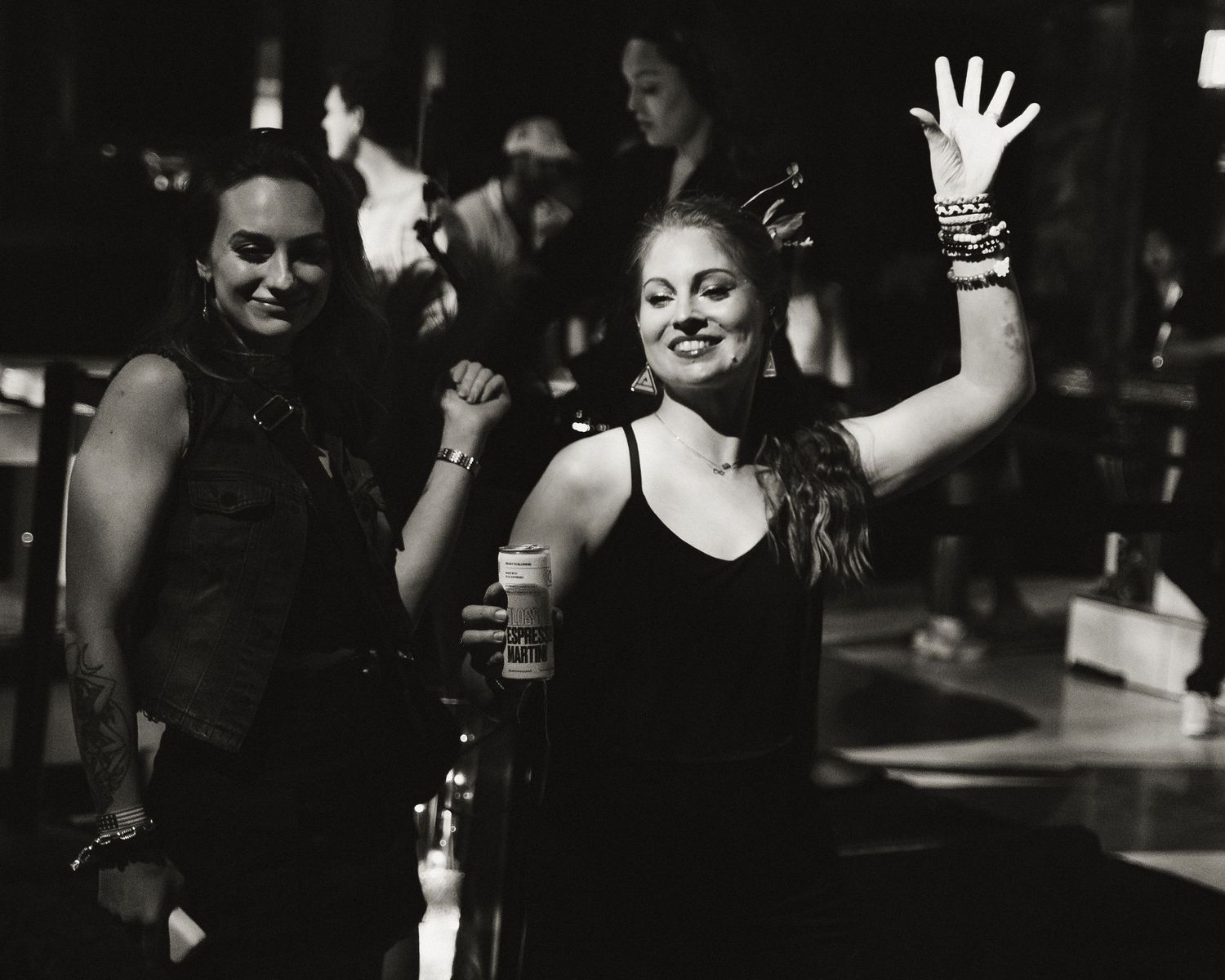 Black and white performance sequence showing expressive movements in low light.