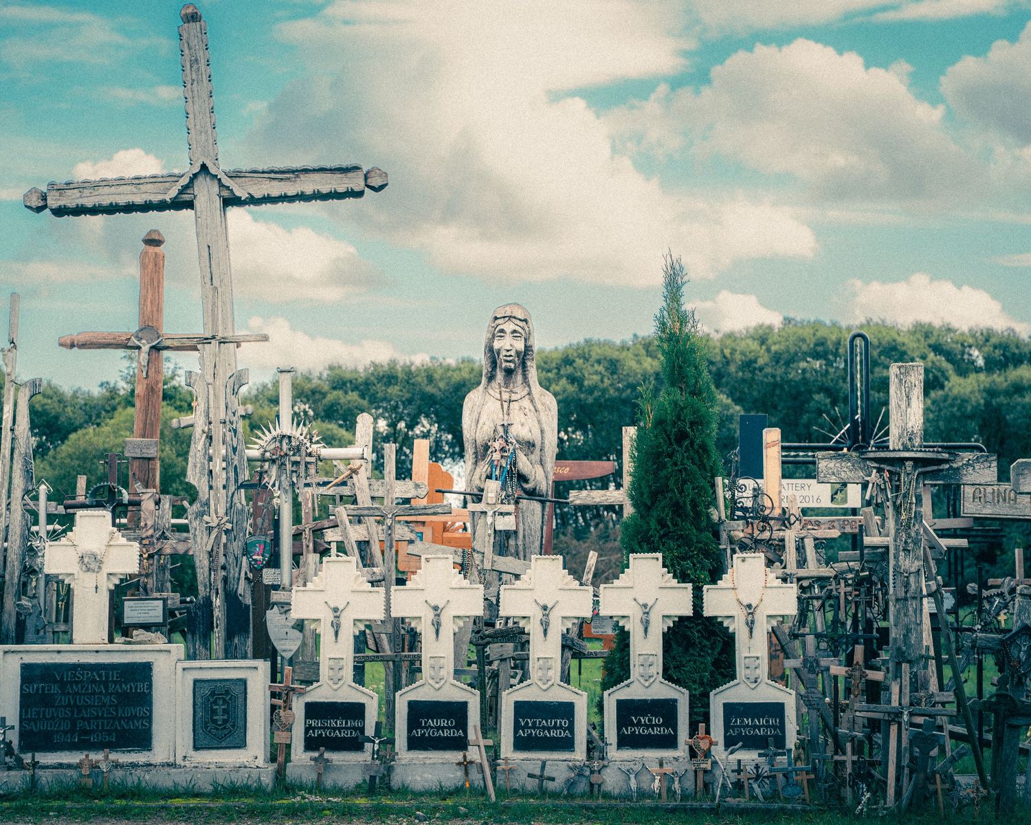 Panoramic view of religious crosses and monuments stretching across a hilltop landscape.