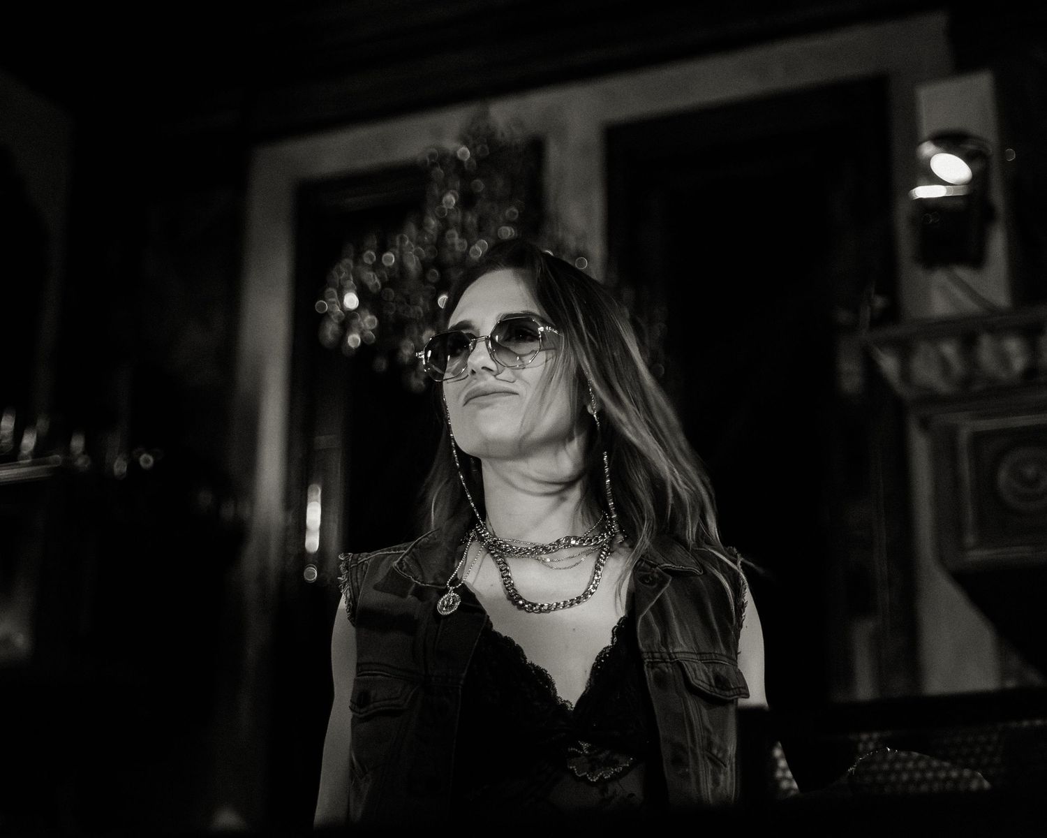 Expressive performance captured in a sequence of black and white nightclub photos.
