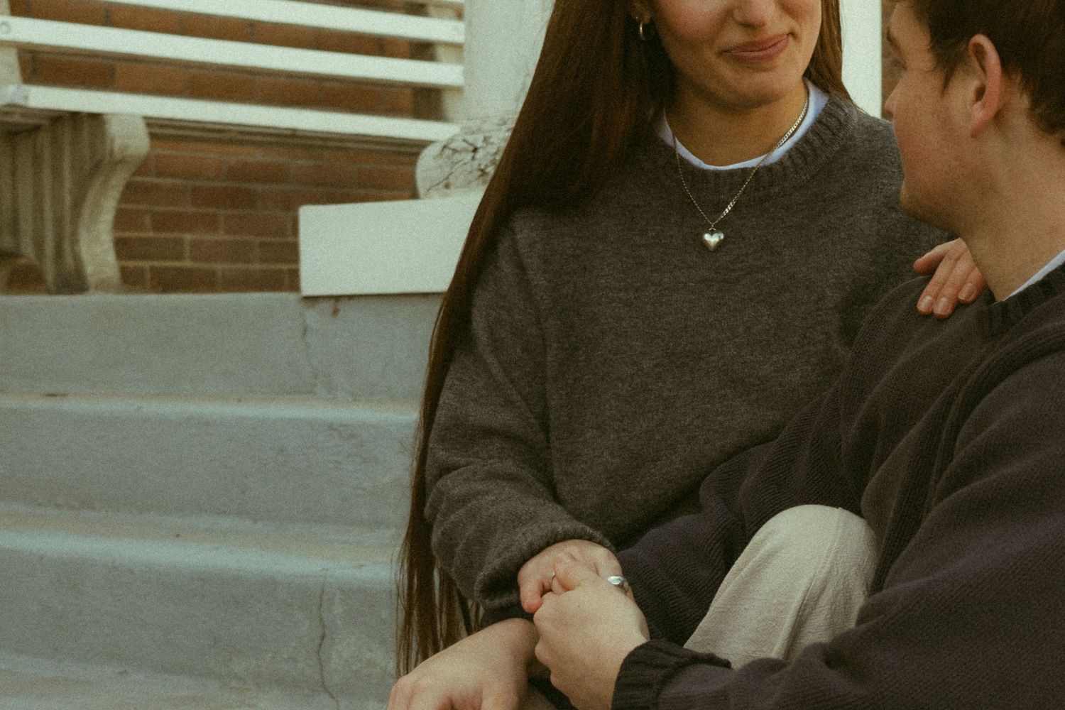 People sitting together and sharing intimate conversations in a casual indoor setting.