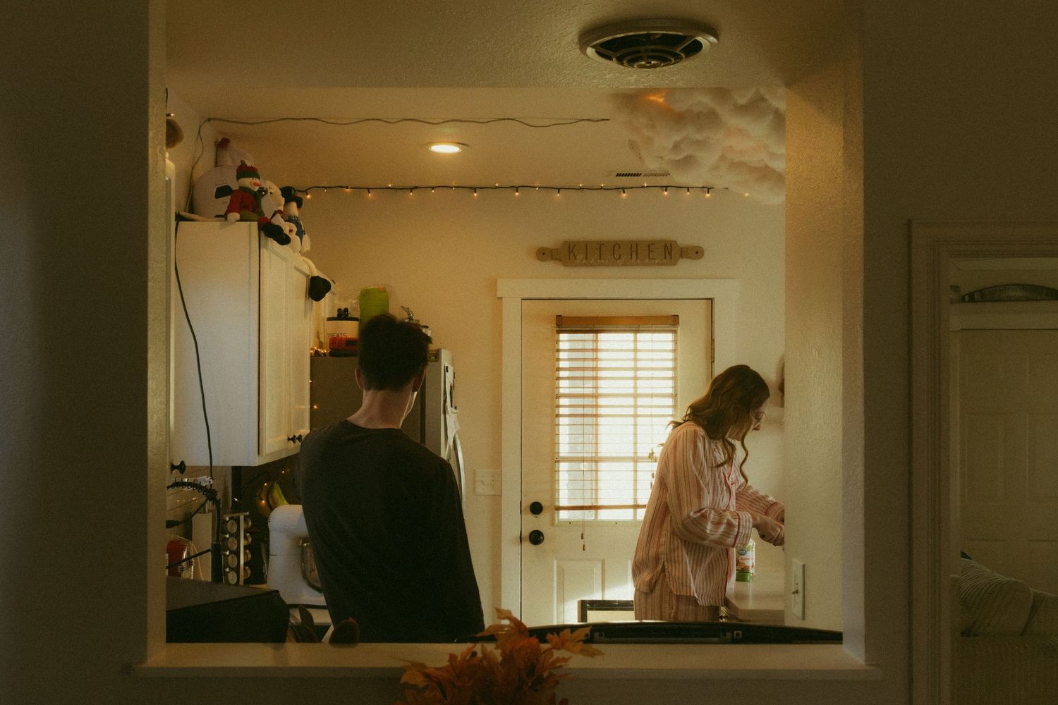 Four connected interior photos show a dimly lit home renovation in progress with tools and construction materials visible.