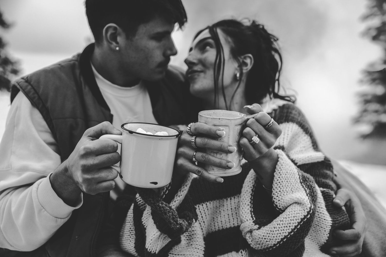 Black and white photos showing romantic moments while sharing warm beverages.