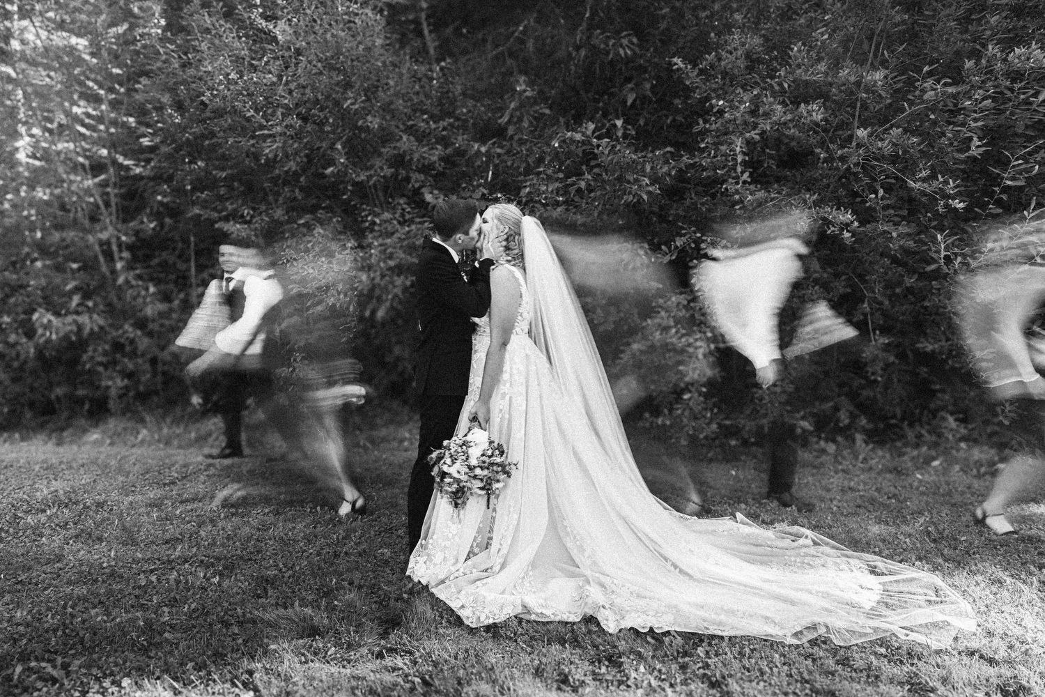 Wedding dress flowing in the wind during an outdoor photoshoot in nature.