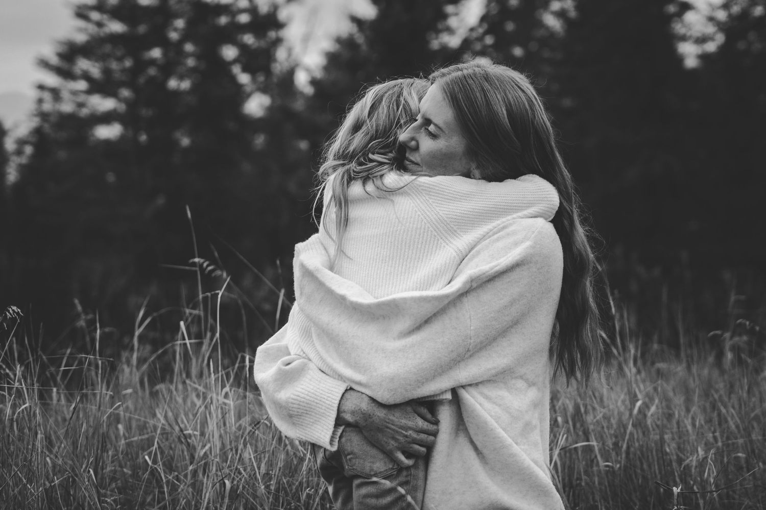 Intimate black and white portrait series captured in a natural outdoor setting.