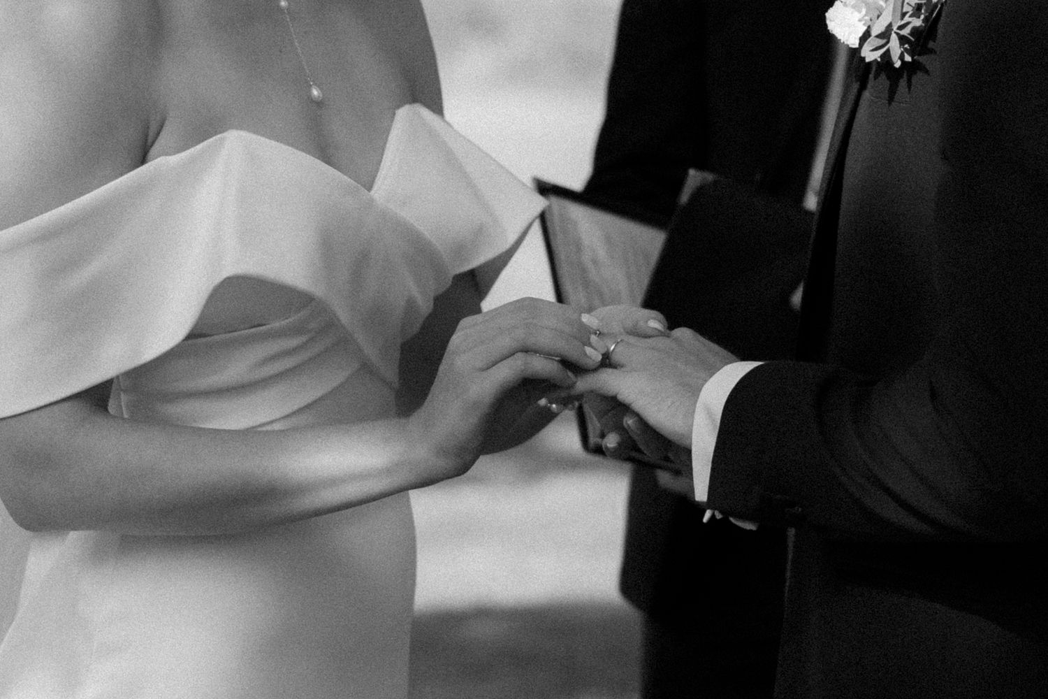 A black and white wedding photo series showing intimate moments between a couple during their special day.