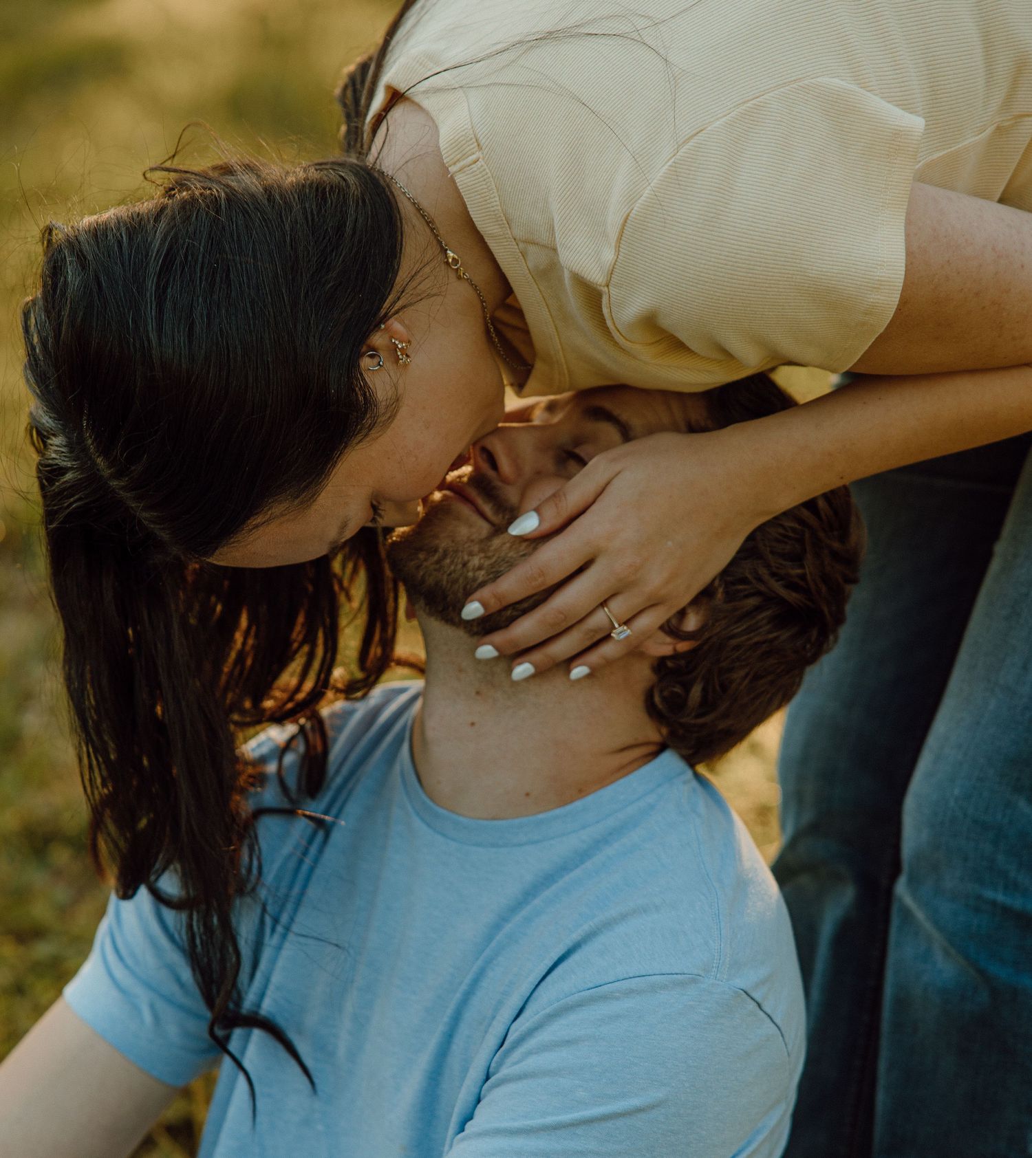 Intimate couple photos taken during golden hour in a natural setting.