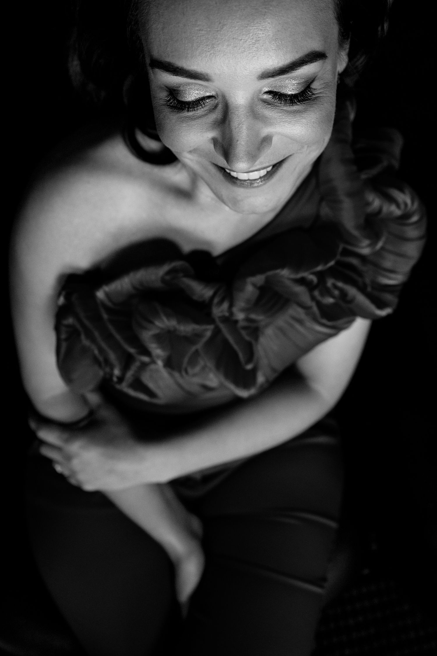 Black and white artistic portrait series showing intimate close-up expressions in dramatic lighting.