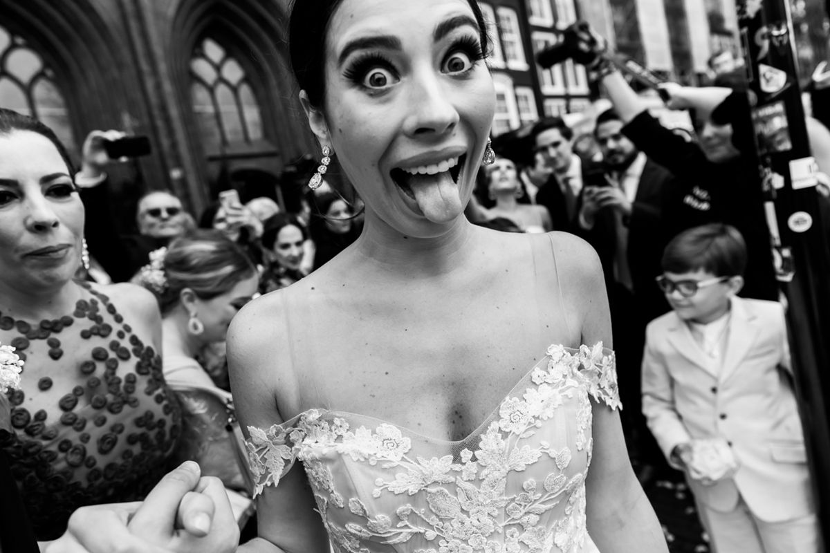 A collection of black and white wedding photos showing joyful moments and celebrations between couples and guests.