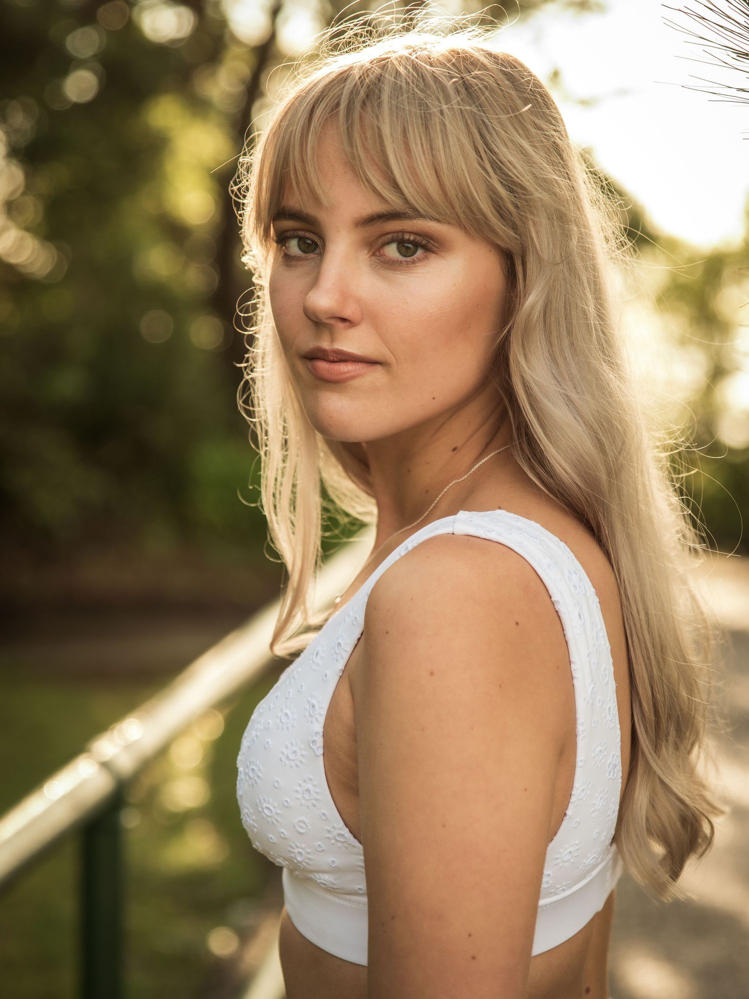 Golden hour portraits with soft backlighting and natural outdoor setting.