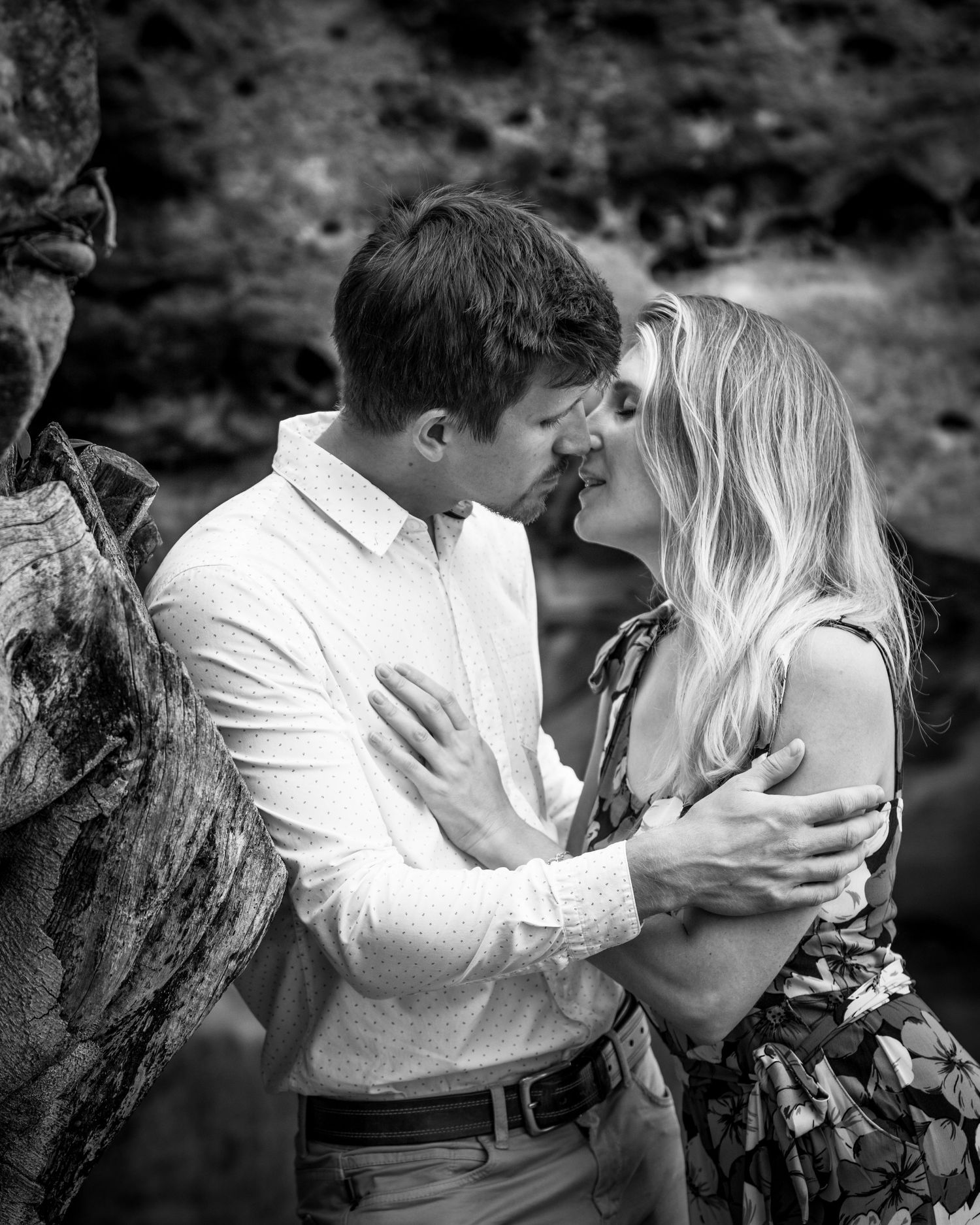Romantic black and white portrait series showing intimate moments between a couple.