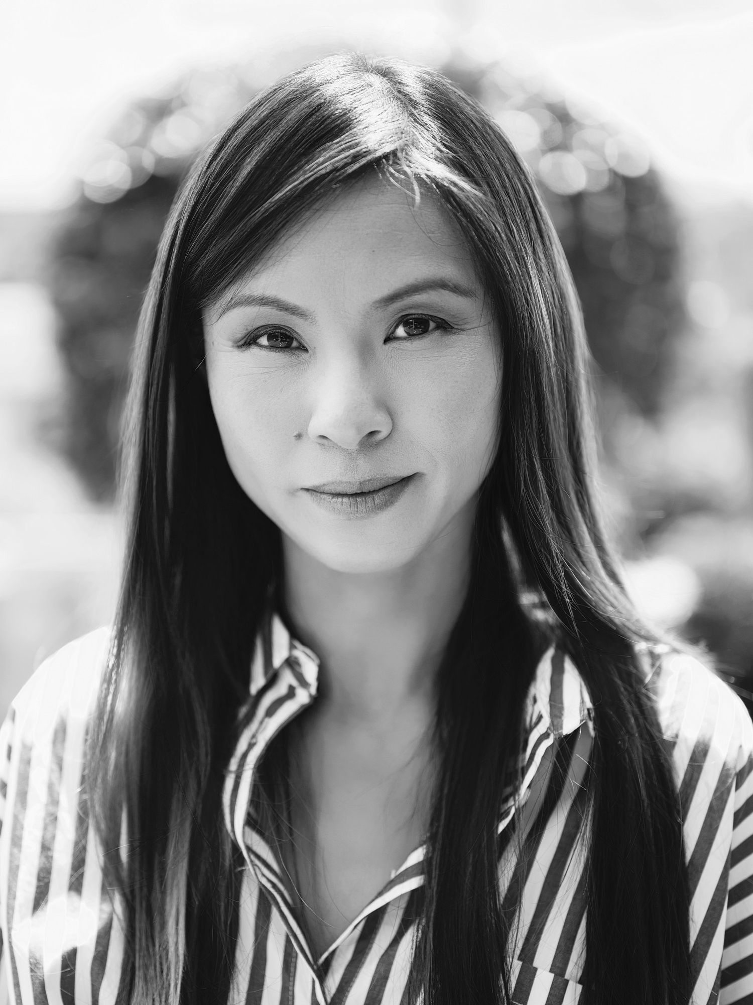 Black and white portrait series with playful expressions and natural lighting.