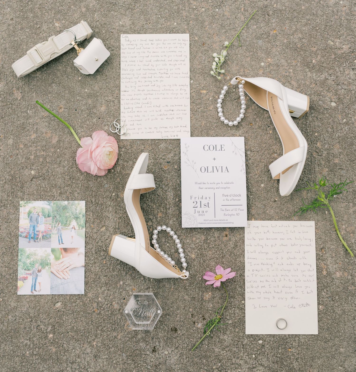 Elegant wedding details including invitations, white heels, pearls, and pink flowers arranged on a concrete background.