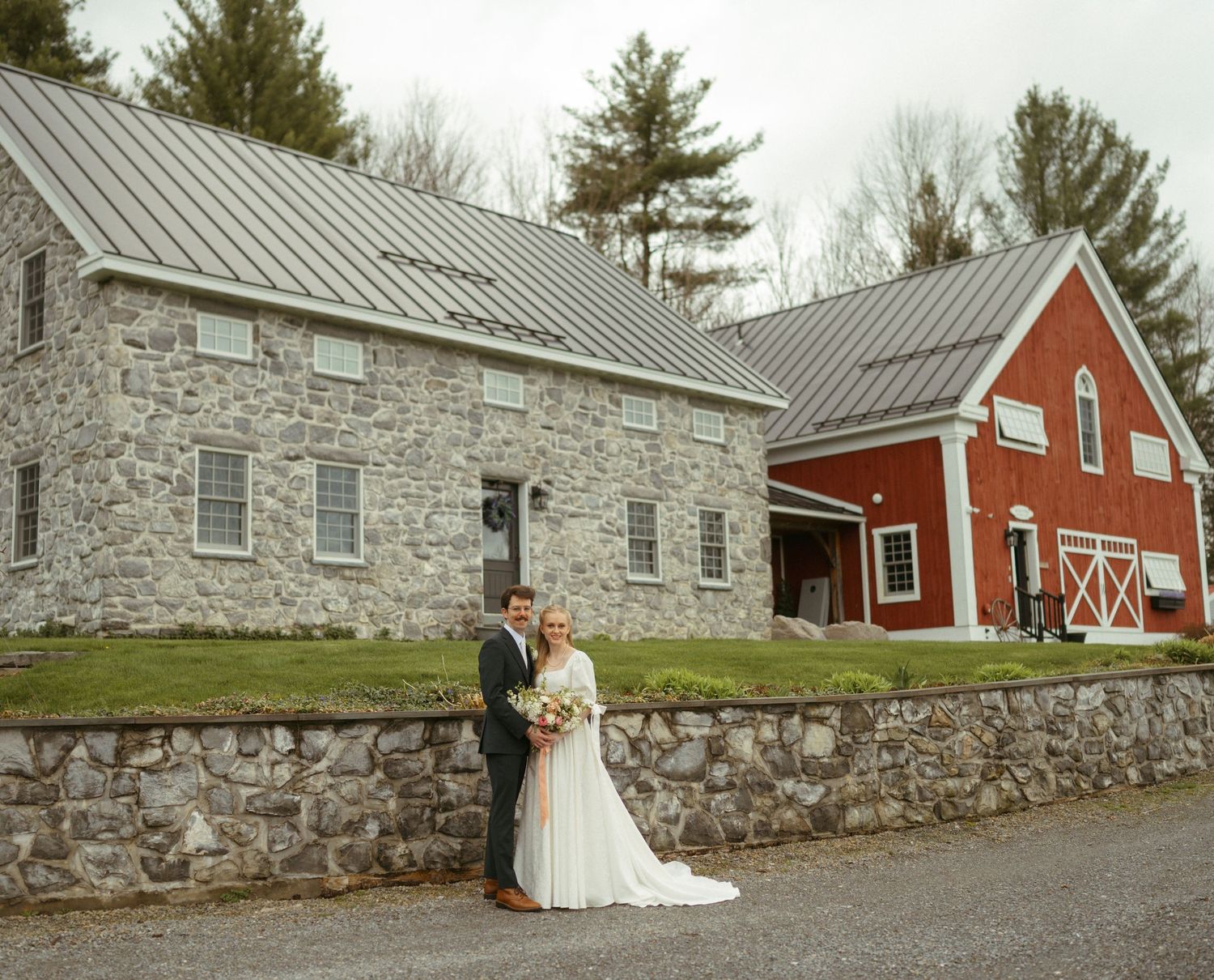A series of outdoor wedding photos showing stone buildings and red barns in a rustic countryside setting.