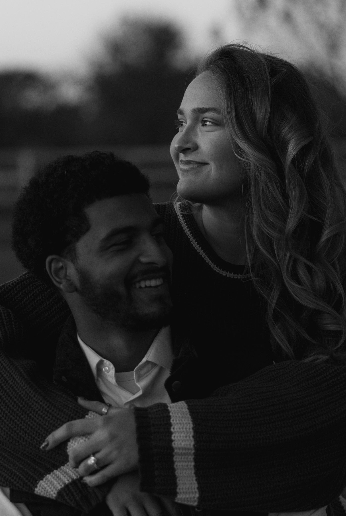 Romantic black and white close-up of a couple sharing a tender moment.