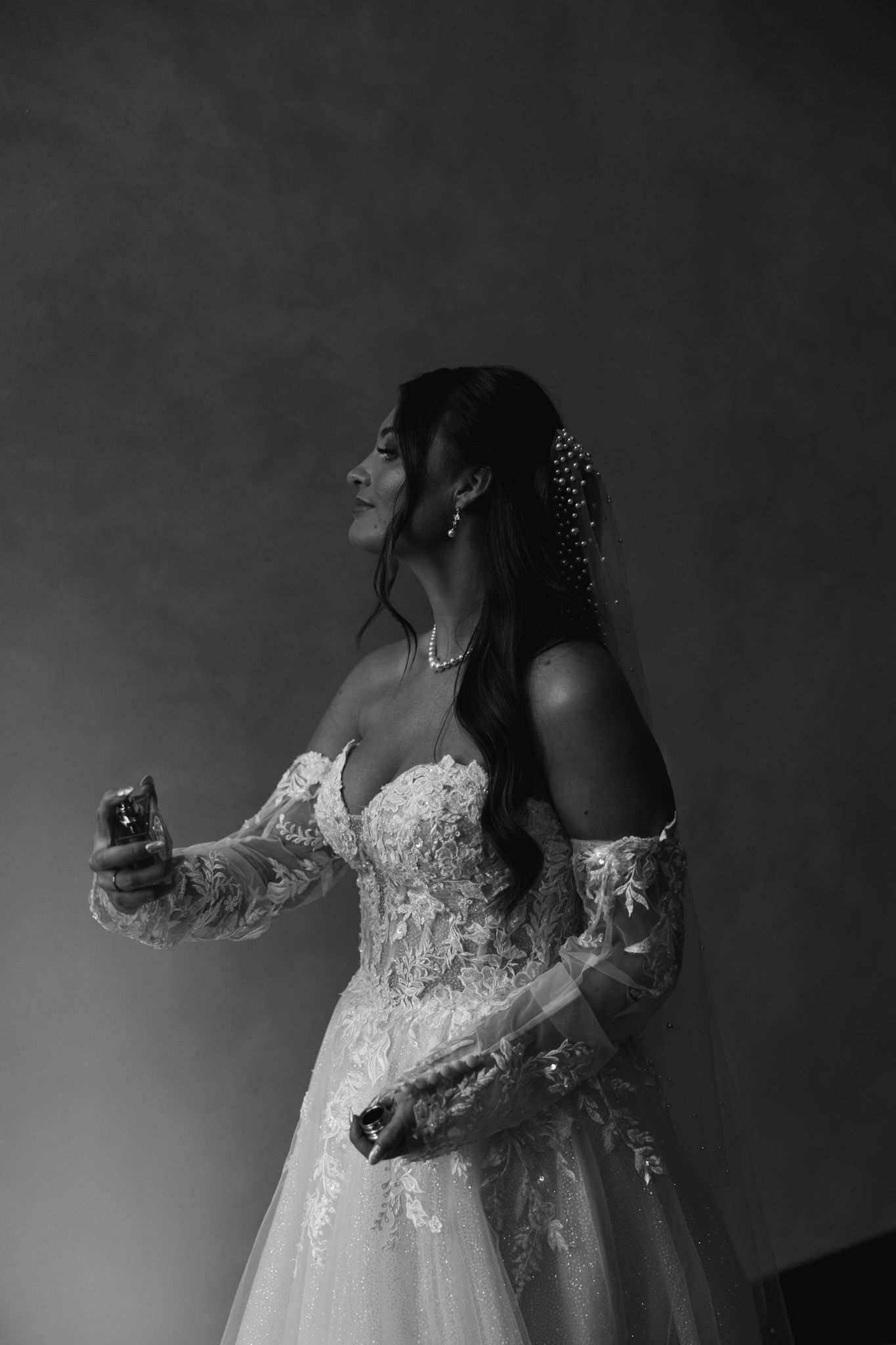 A series of artistic black and white bridal portraits showing a woman in a lace wedding dress against a dark background.
